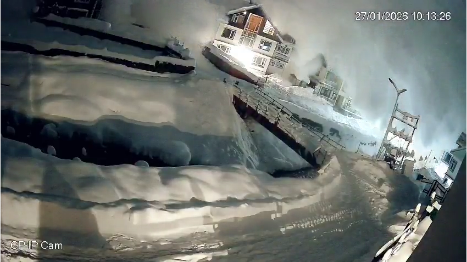 A still frame from the CCTV video showing snow rushing through buildings at the Sonamarg resort during the avalanche.