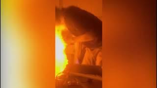 A still frame from the video showing the flaming shot on the table before the fire spreads, avoiding close-up or graphic imagery.