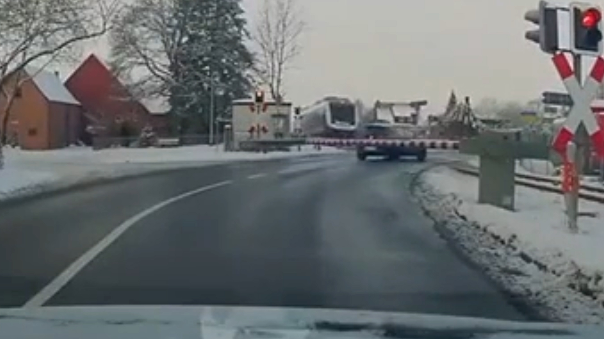 Video frame showing a damaged car on a railway crossing after being struck by a regional train in Eisbergen, Germany.
