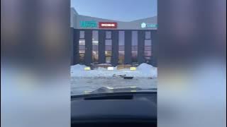 A frame from the video showing the robot tipped over on a snowy surface.